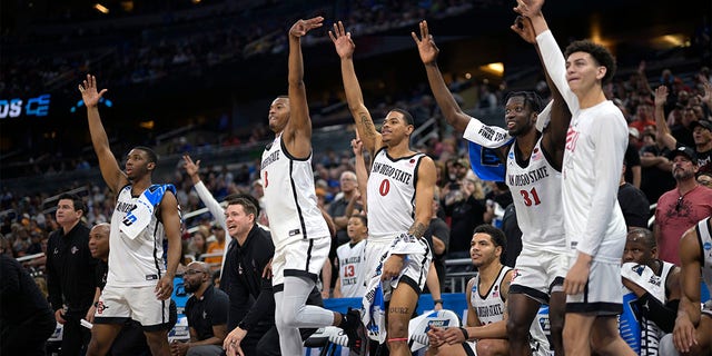 San Diego State players celebrate a teammate's 3-pointer late in the second half of a second-round college basketball game against Furman in the NCAA Tournament, Saturday, March 18, 2023, in Orlando, Fla. 