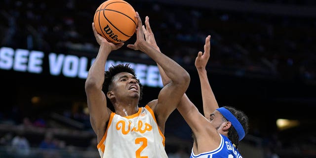 Tennessee forward Julian Phillips (2) shoots as Duke guard Jacob Grandison (13) defends during the first half of a second-round NCAA Tournament game Saturday, March 18, 2023, in Orlando, Fla.