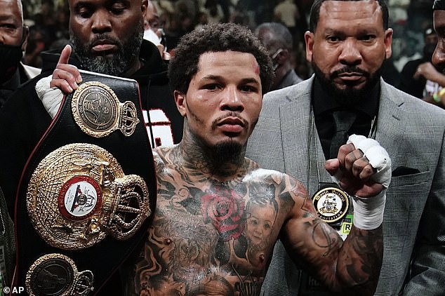 Davis poses with the WBA lightweight championship belt after beating Rolando Romero