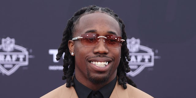 Joey Porter Jr. smiles on red carpet