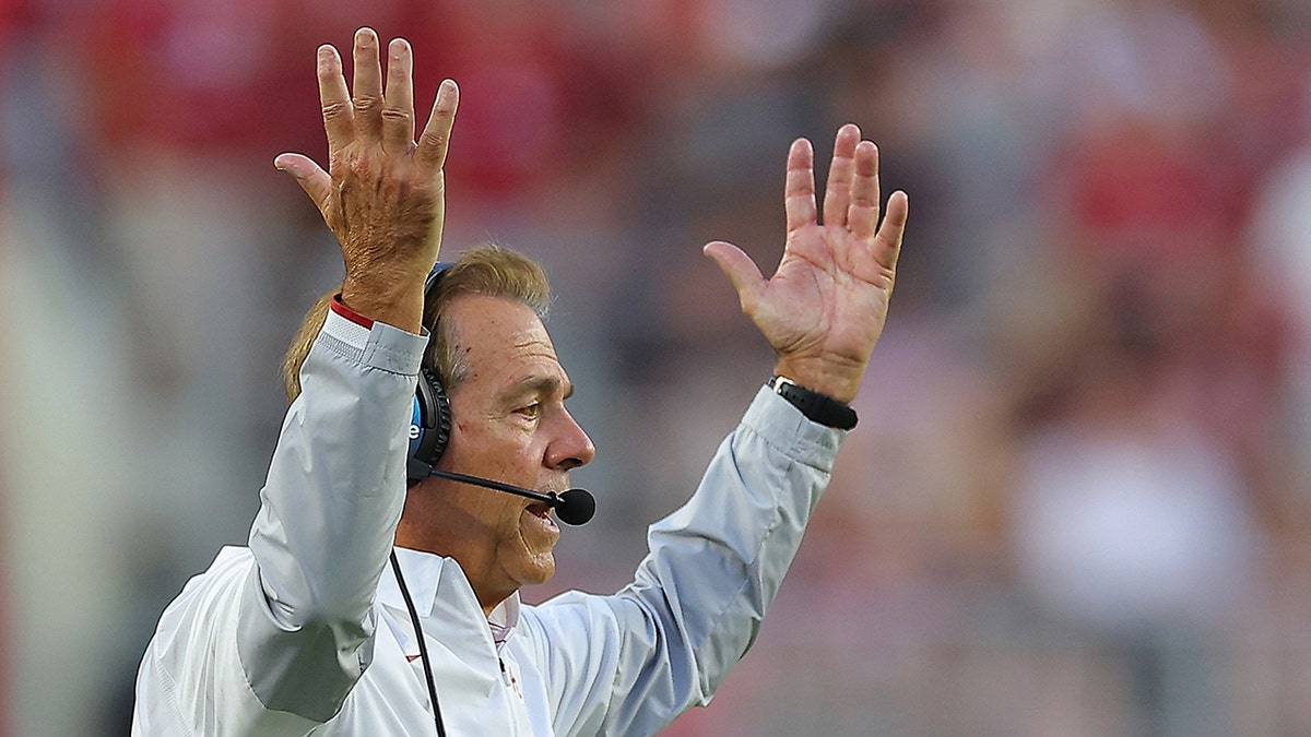 Nick Saban throws hands up